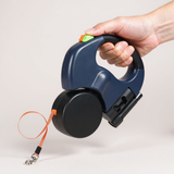 Twin Trail dual retractable dog leash held in hand